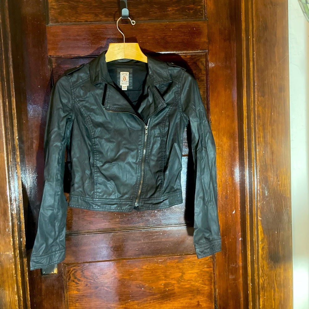 Black cotton, leather-look jacket.